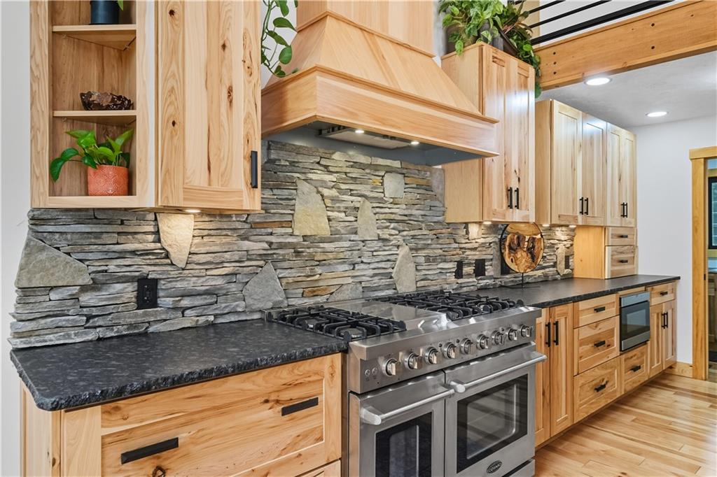 292 Golden Ridge Drive Somerset, PA 15501 - Photo 21 of 49 a kitchen with stainless steel appliances granite countertop a sink stove and cabinets