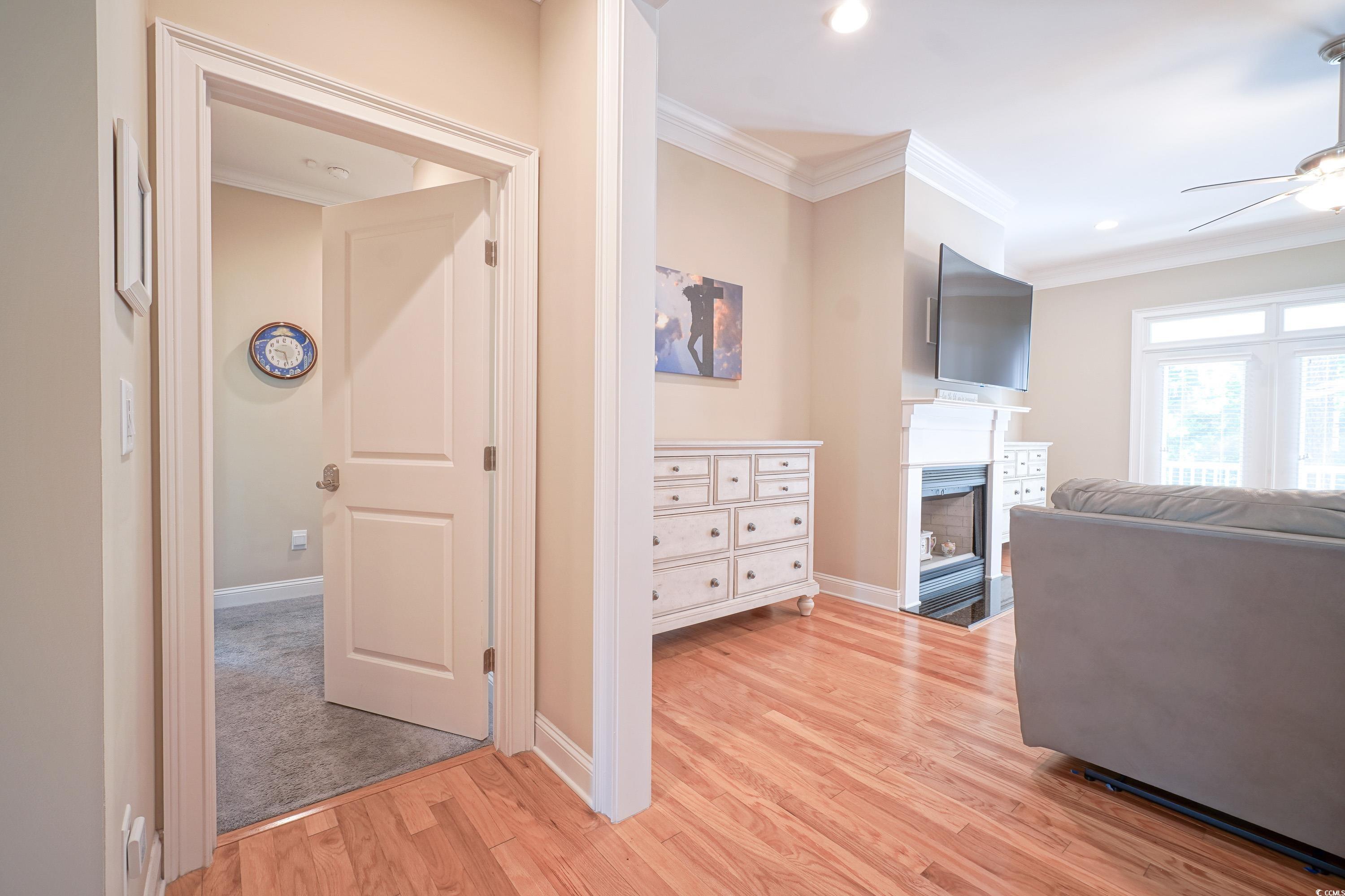 625 Whispering Pines Court Murrells Inlet, SC 29576 - Photo 12 of 36 Private entrance to main bedroom featuring crown molding, baseboards, recessed lighting, and light wood-type flooring