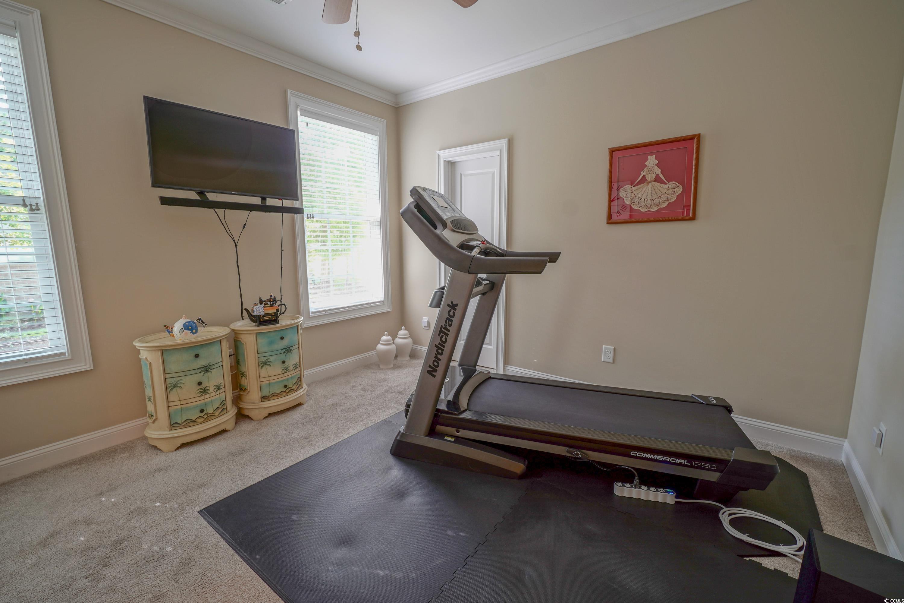 625 Whispering Pines Court Murrells Inlet, SC 29576 - Photo 19 of 36 2nd Bedroom with crown molding, a ceiling fan, baseboards, and carpet