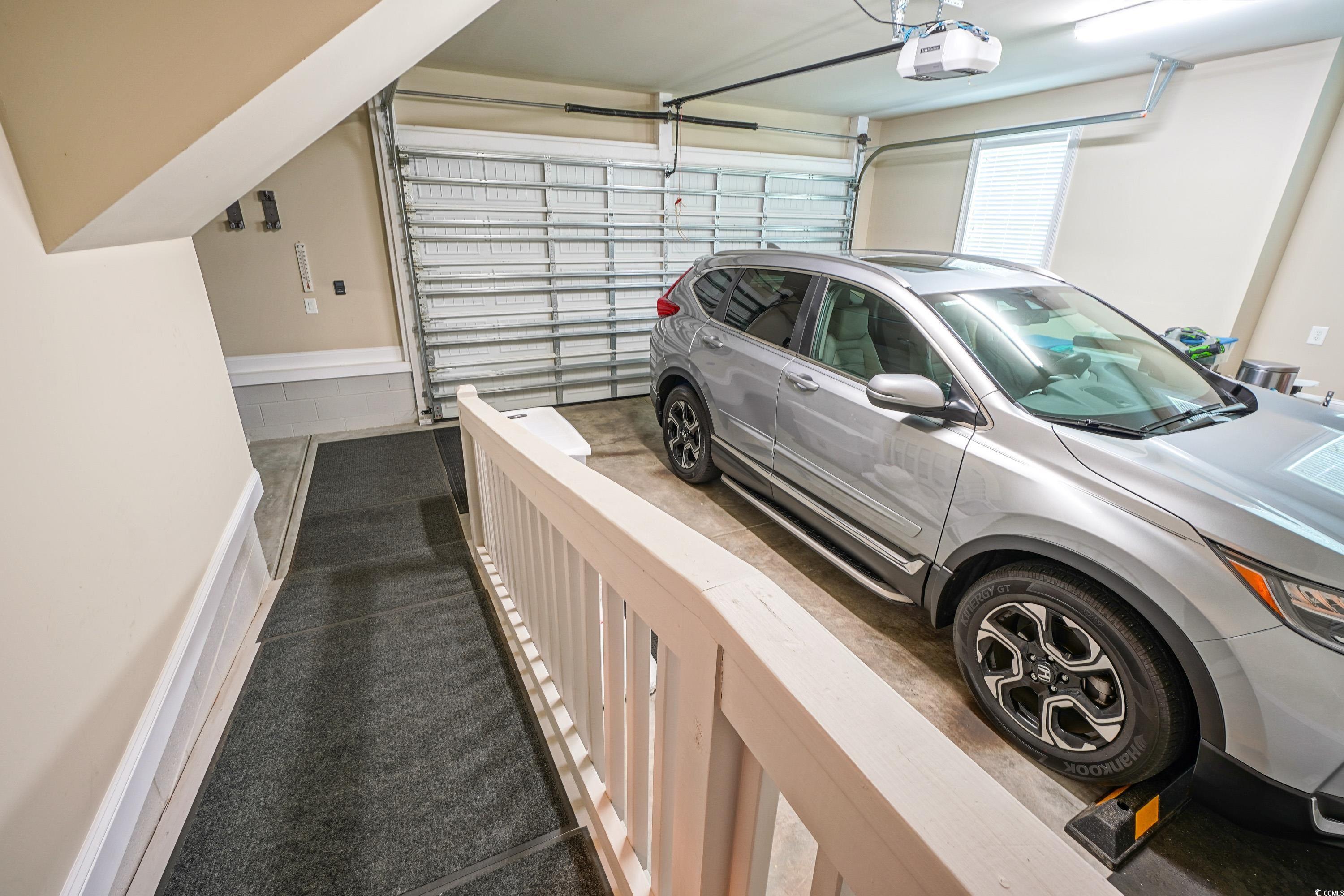 625 Whispering Pines Court Murrells Inlet, SC 29576 - Photo 30 of 36 Garage with a garage door opener