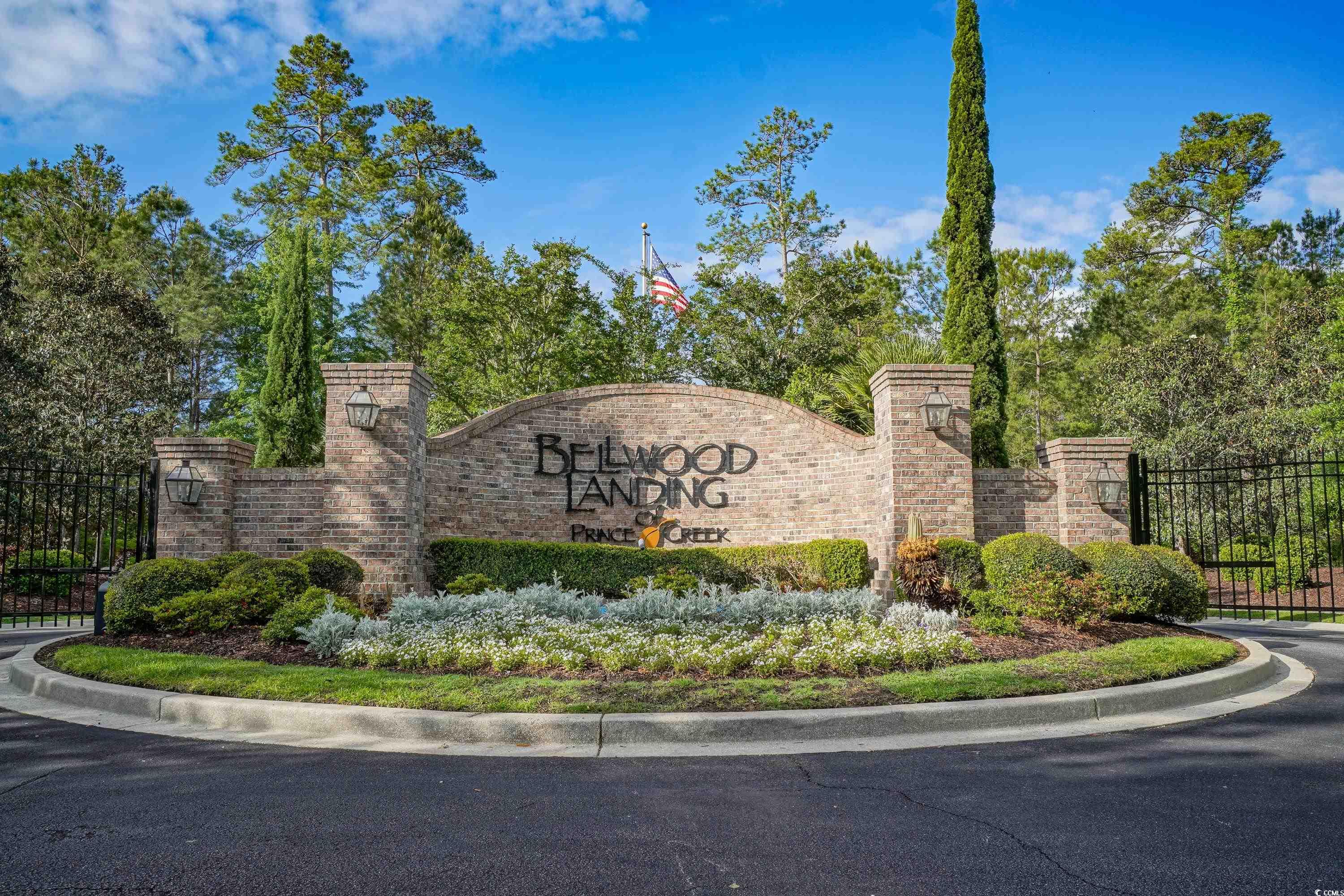 625 Whispering Pines Court Murrells Inlet, SC 29576 - Photo 32 of 36 Community sign with fence