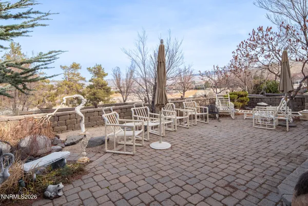 a view of a backyard with sitting area