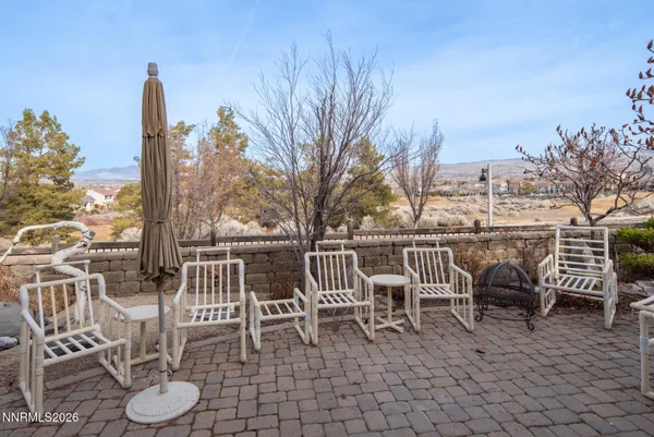 a chairs and a table in the patio