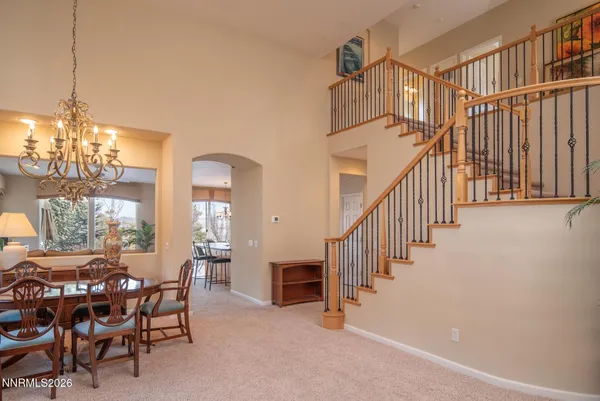 a view of a livingroom with furniture and windows