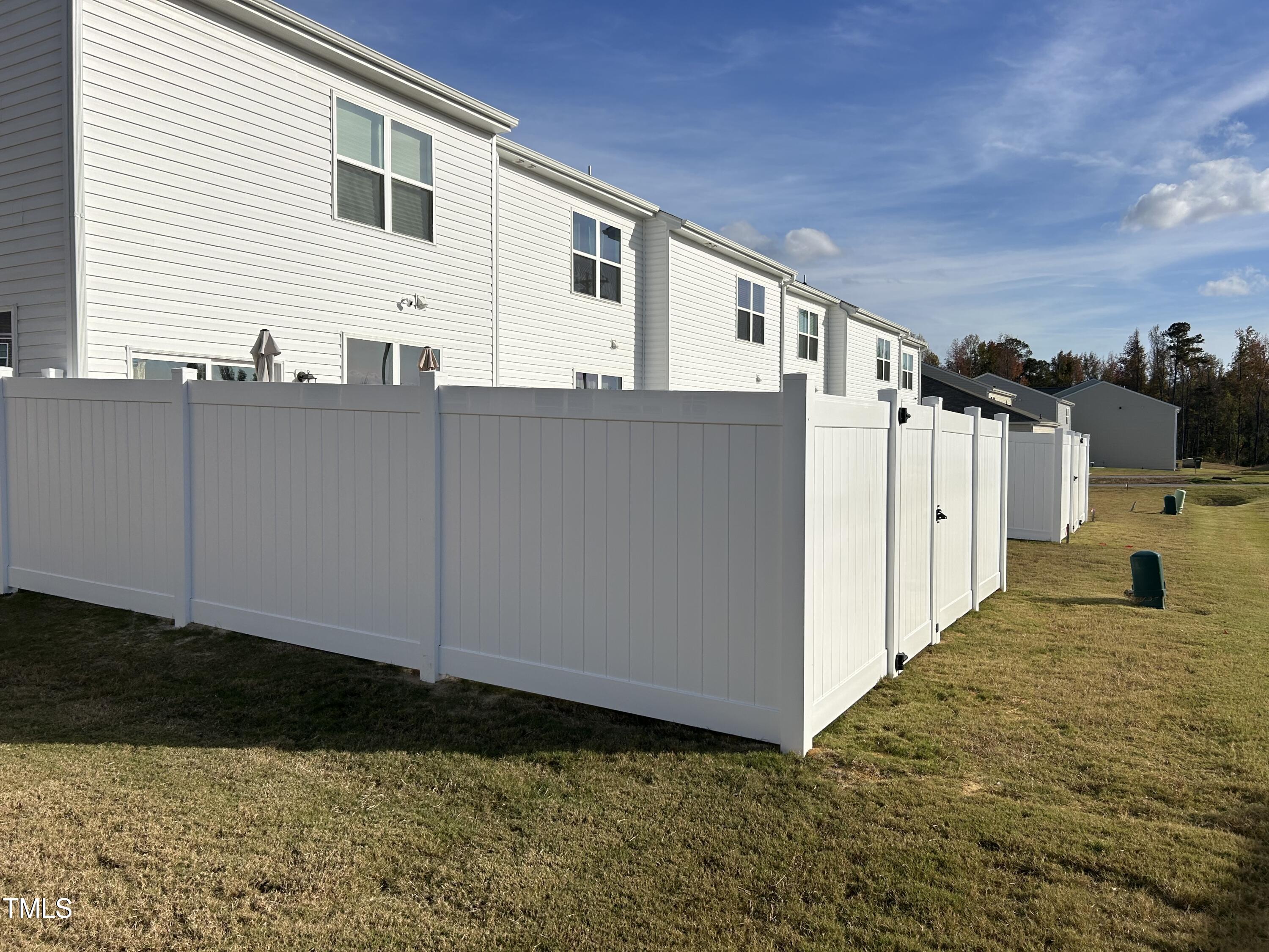 145 North Chubb Ridge Wilson's Mills, NC 27520 - Photo 23 of 29 Fence on townhome