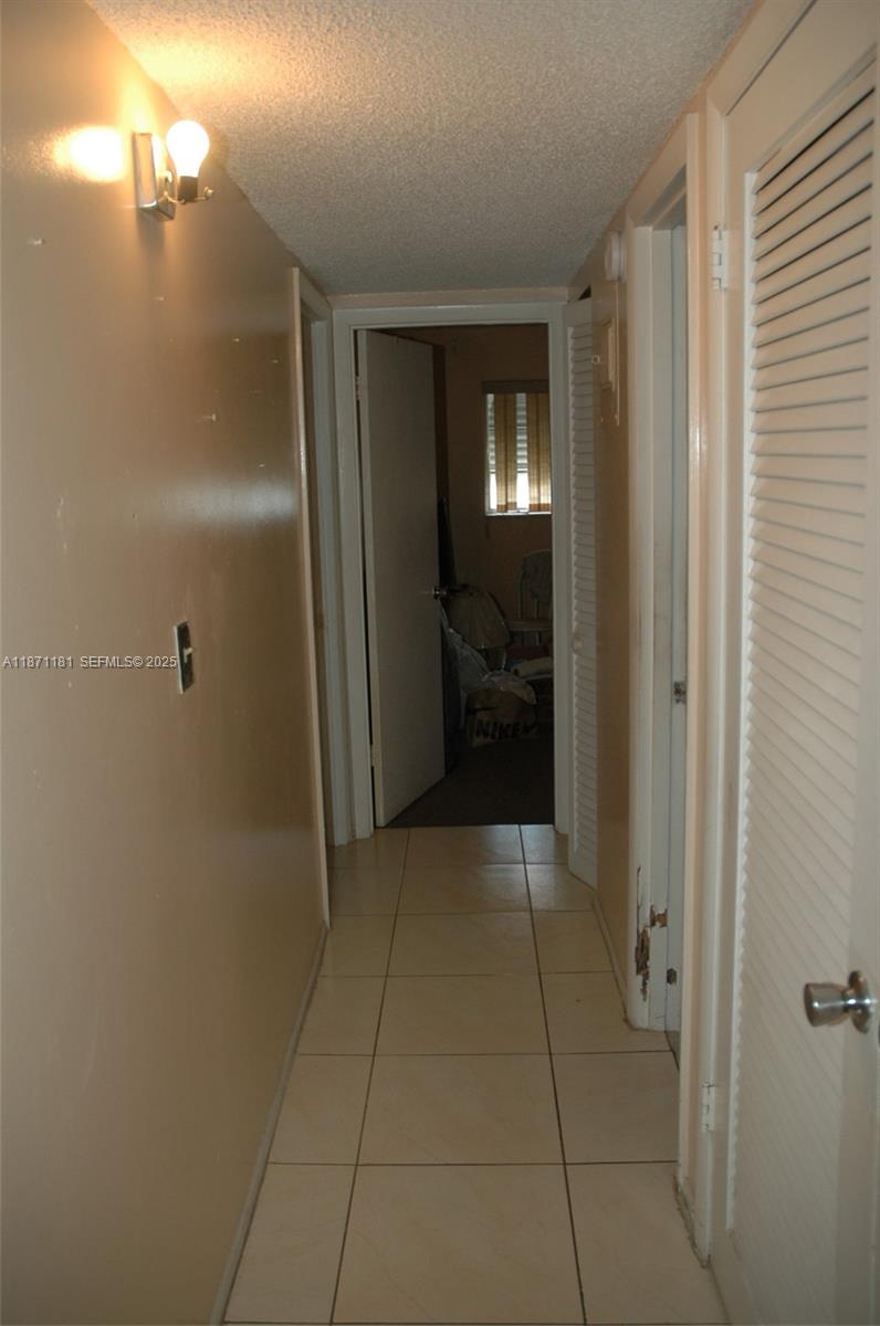 5300 Washington Street, Unit Q307 Hollywood, FL 33021 - Photo 11 of 21 a bathroom with a glass door shower