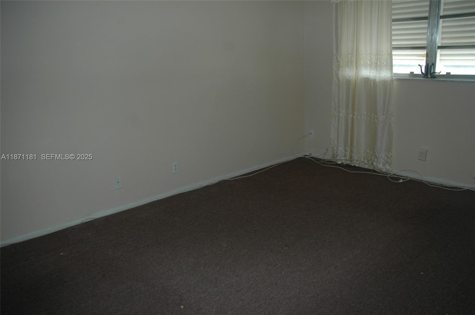 5300 Washington Street, Unit Q307 Hollywood, FL 33021 - Photo 13 of 21 an empty room with a window