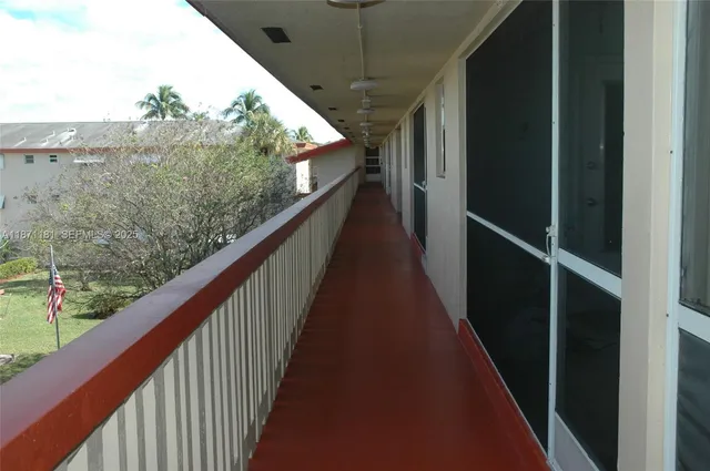 a view of a table and chairs in backyard