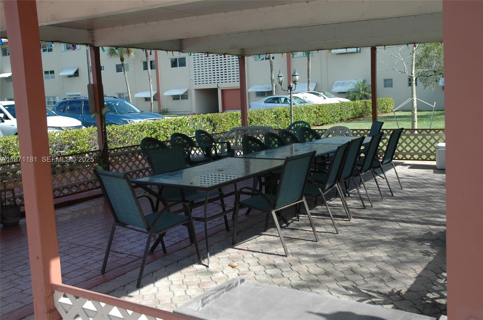 5300 Washington Street, Unit Q307 Hollywood, FL 33021 - Photo 19 of 21 a view of an outdoor dining space with furniture