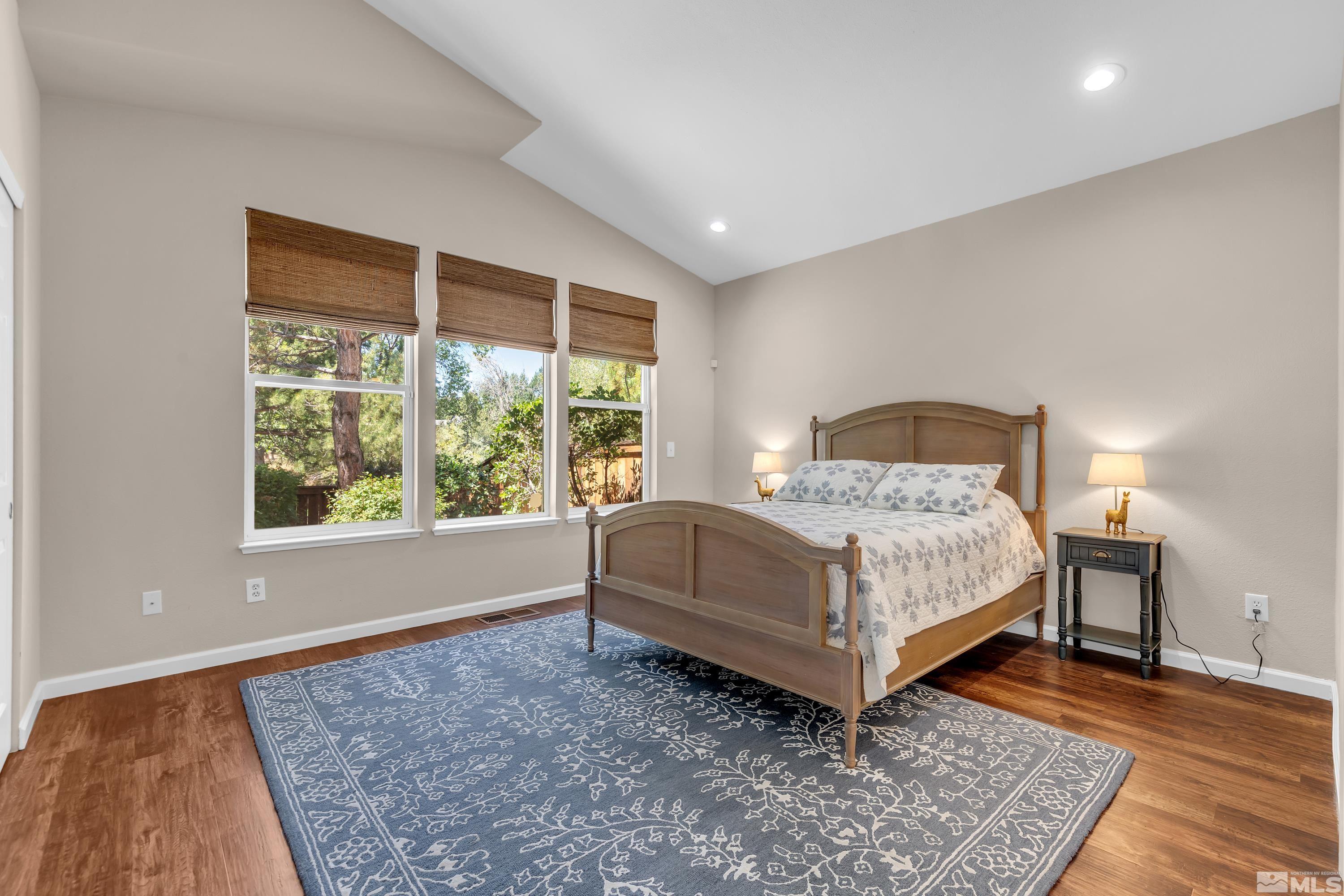 809 Caughlin Glen Reno, NV 89519 - Photo 11 of 23 a bedroom with a bed lamp and a large window