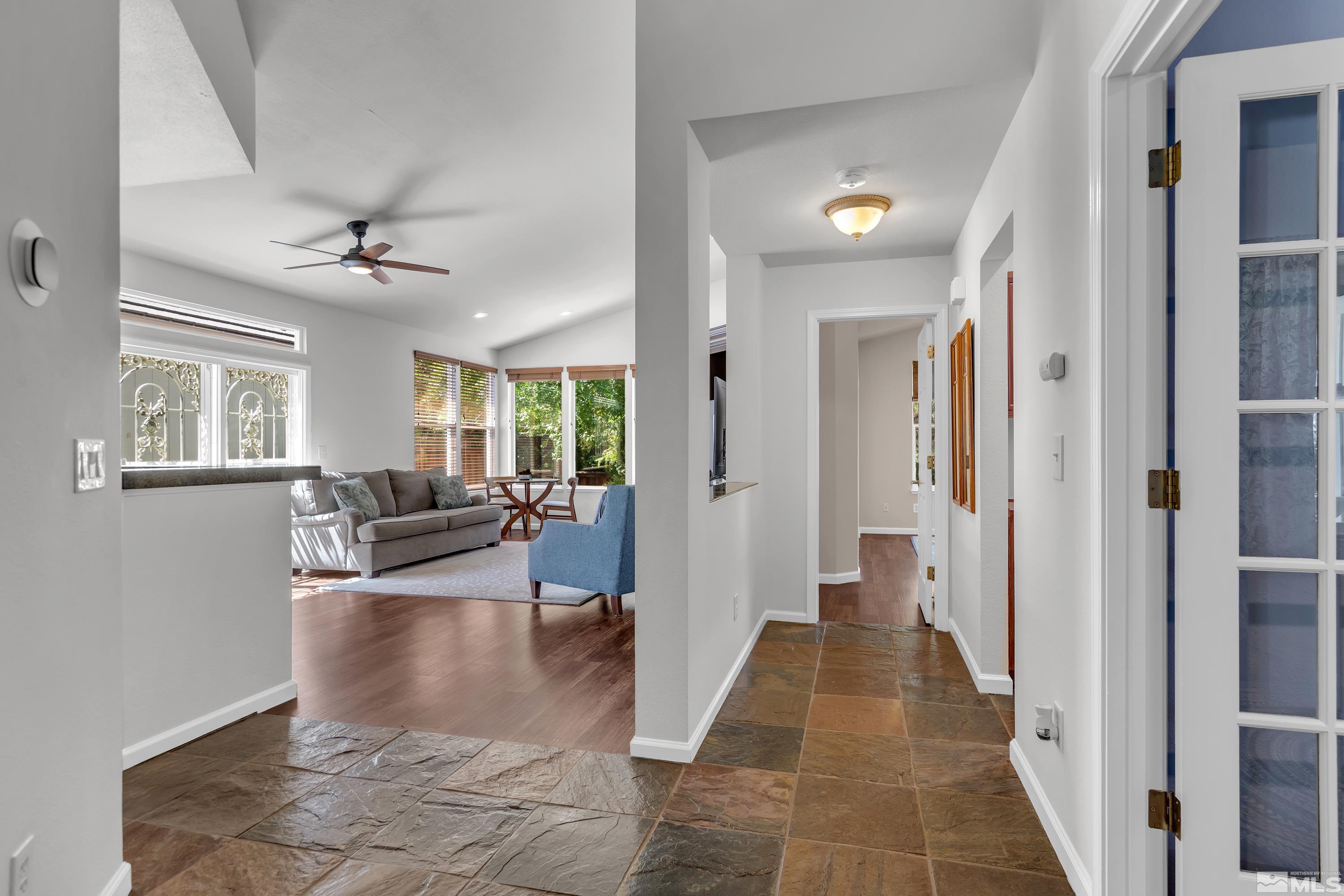 809 Caughlin Glen Reno, NV 89519 - Photo 4 of 23 a view of a livingroom with furniture and a ceiling fan