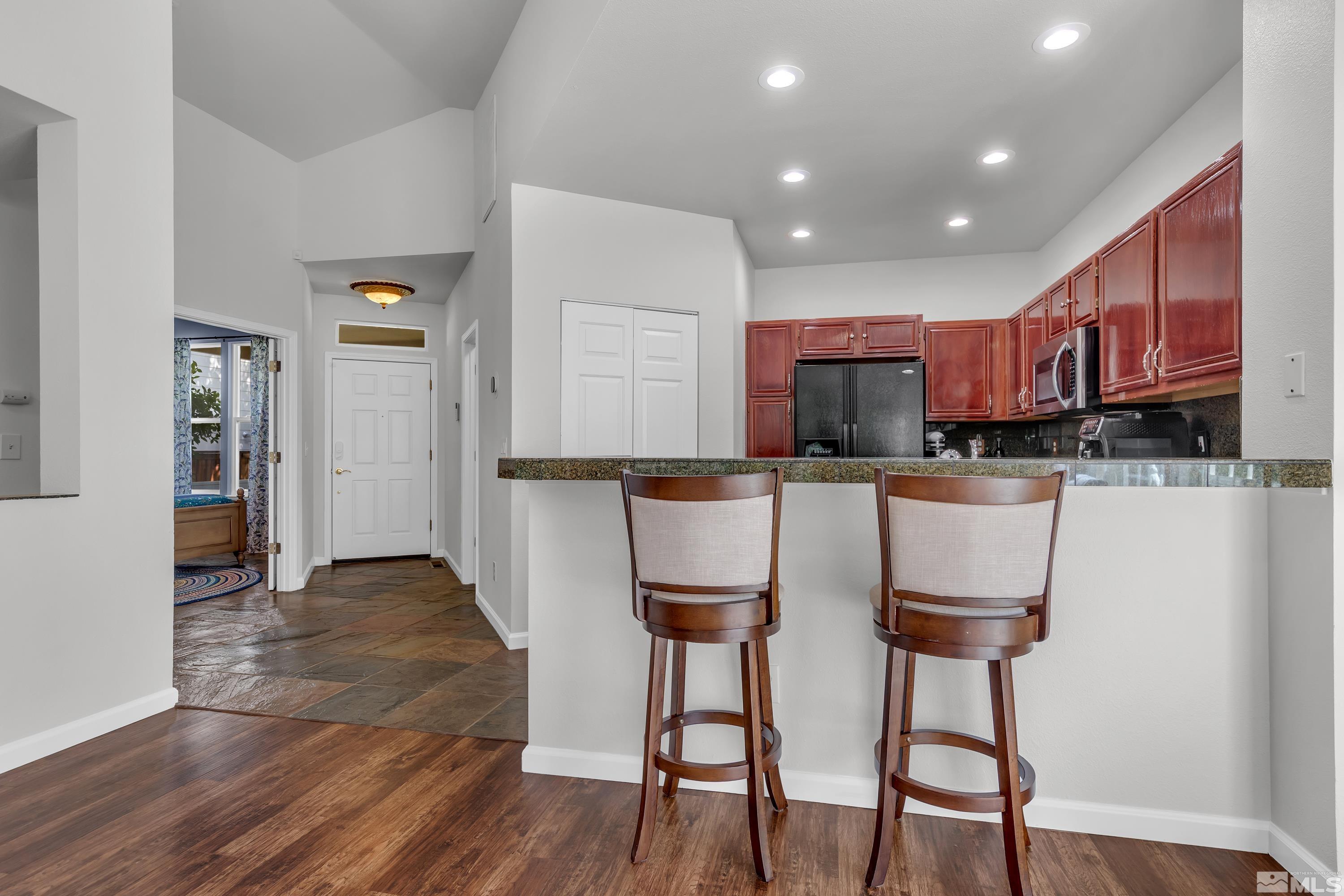 809 Caughlin Glen Reno, NV 89519 - Photo 5 of 23 a kitchen with stainless steel appliances granite countertop a refrigerator and a stove top oven