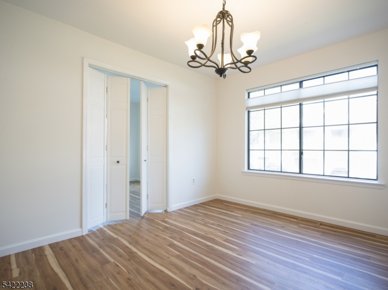 2301 Privet Way Bernards, NJ 07920 - Photo 11 of 30 a view of empty room with wooden floor and fan