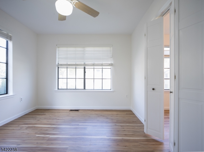 2301 Privet Way Bernards, NJ 07920 - Photo 14 of 30 an empty room with wooden floor and windows