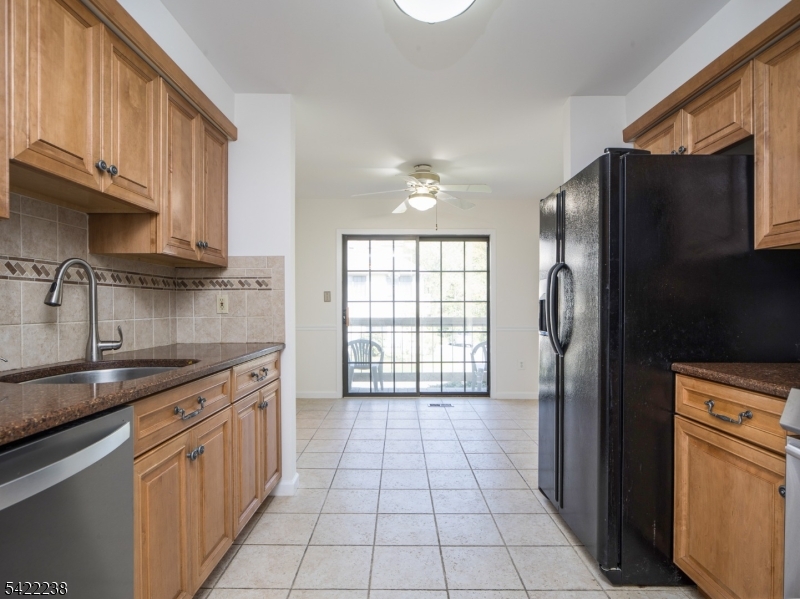 2301 Privet Way Bernards, NJ 07920 - Photo 8 of 30 a kitchen with stainless steel appliances granite countertop a refrigerator a sink a stove and island