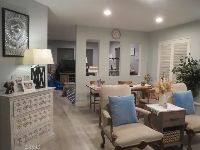 a living room with furniture a lamp and a table