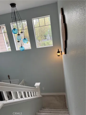 a view of wooden floor and windows in a room