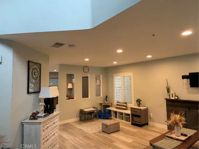a living room with furniture window and wooden floor