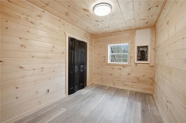 a view of a hardwood & utility room