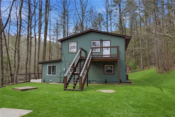 a view of backyard with green space