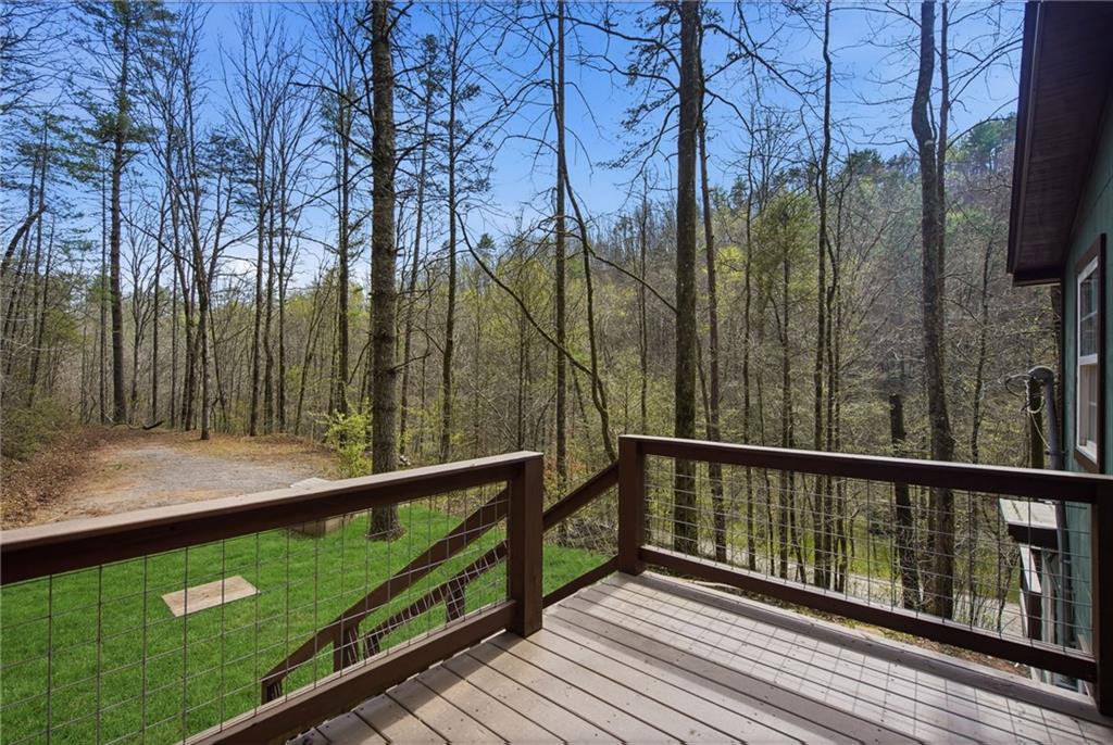 1780 Conasauga Road Ellijay, GA 30540 - Photo 37 of 43 a view of a balcony with trees