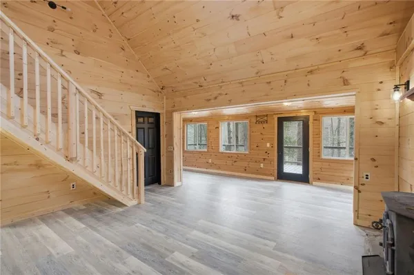 a view of an entryway with wooden floor
