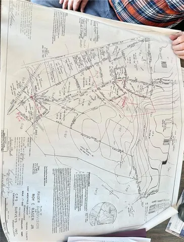 a white bench sitting next to a white wall