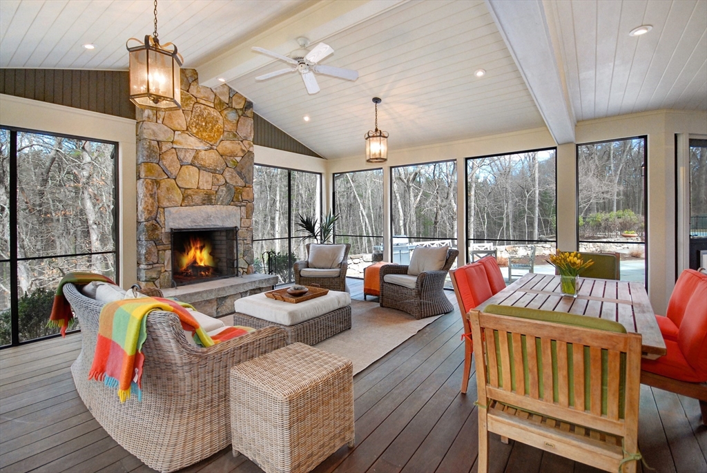 968 Lowell Road Concord, MA 01742 - Photo 3 of 39 a living room with furniture fireplace and a large window