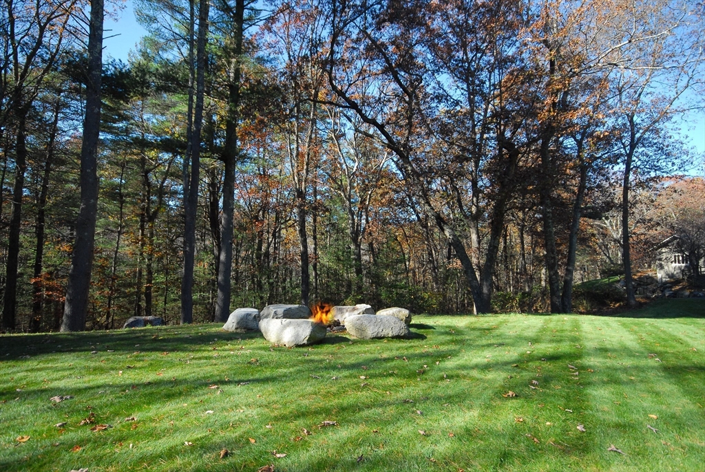 968 Lowell Road Concord, MA 01742 - Photo 33 of 39 a view of a white house with a backyard