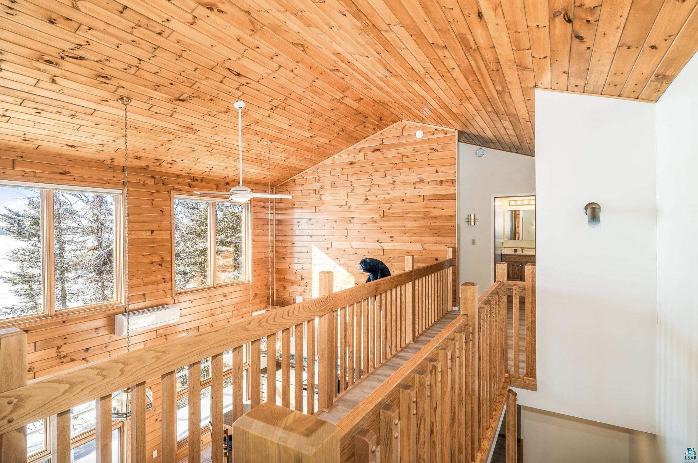 1480 Devil Track Road Grand Marais, MN 55604 - Photo 21 of 38 Vaulted wooden ceiling, wooden walls, and an upstairs landing.