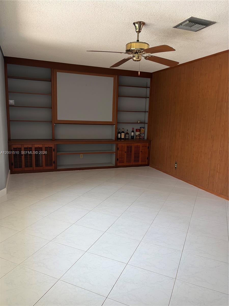 3205 Liberty Street Hollywood, FL 33021 - Photo 6 of 12 a view of room with stairs and a table