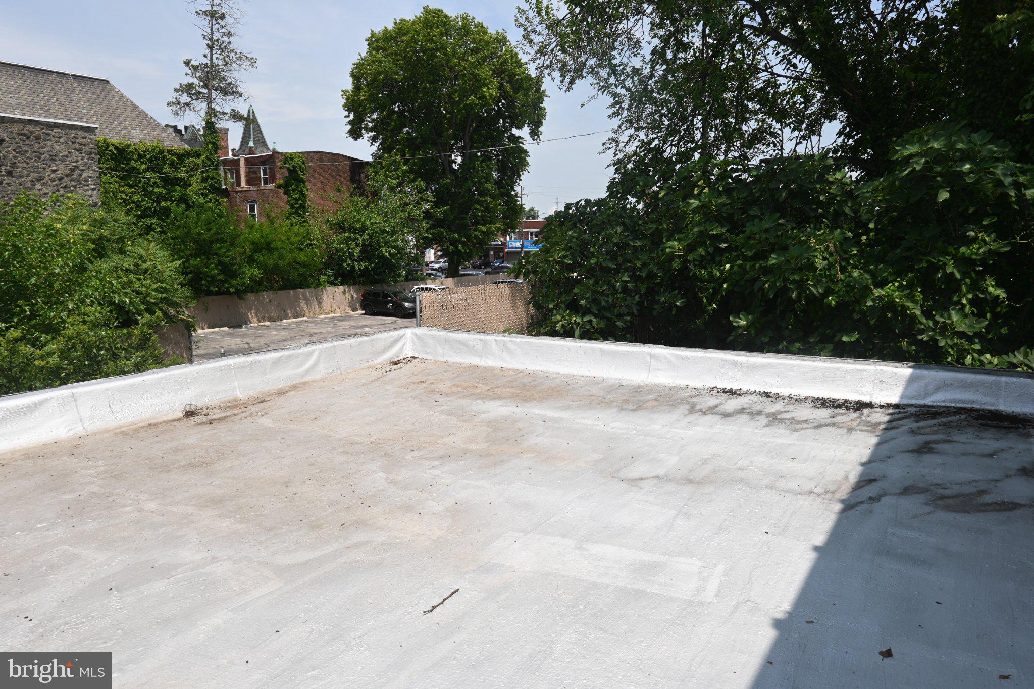 433 North Gross Street Philadelphia, PA 19151 - Photo 24 of 30 Urban rooftop with lush greenery.