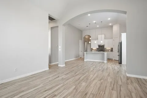 a view of a kitchen with wooden floor