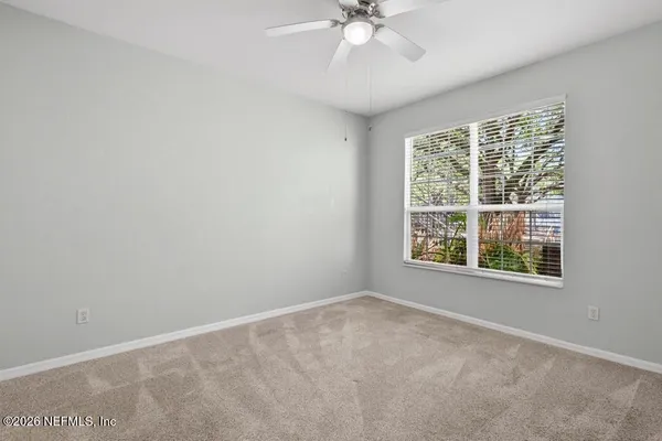 a white refrigerator freezer and a stove sitting inside of a kitchen