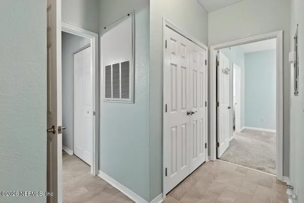 a kitchen with a sink and a potted plant
