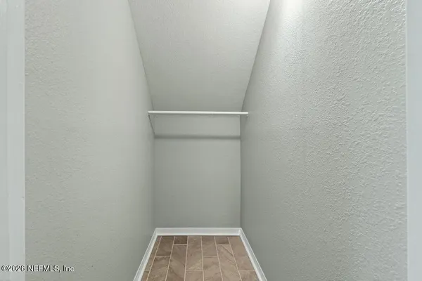 a kitchen with a sink a stove and cabinets