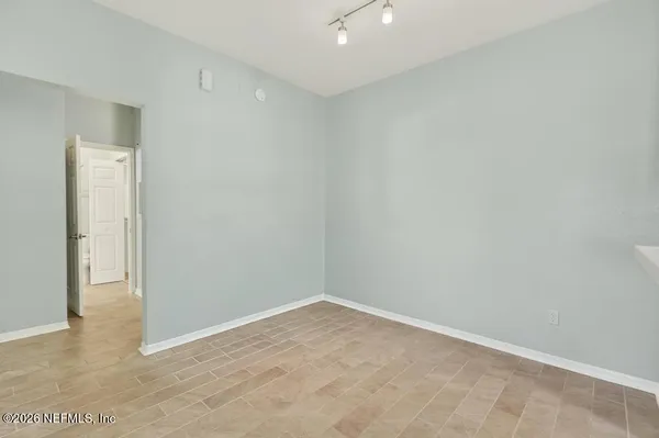 a kitchen with a sink a stove and a refrigerator