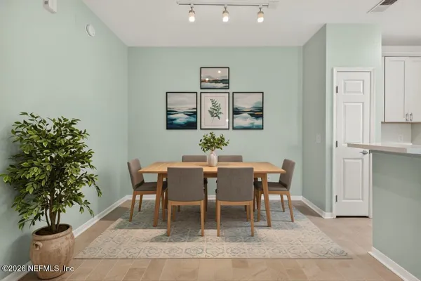 a kitchen with a refrigerator sink and cabinets