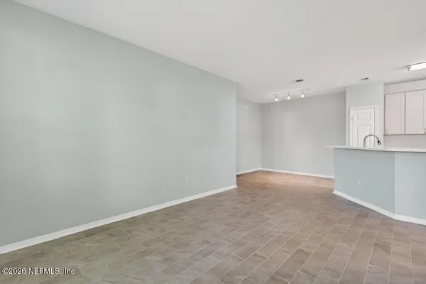 a view of swimming pool with outdoor seating and a garden