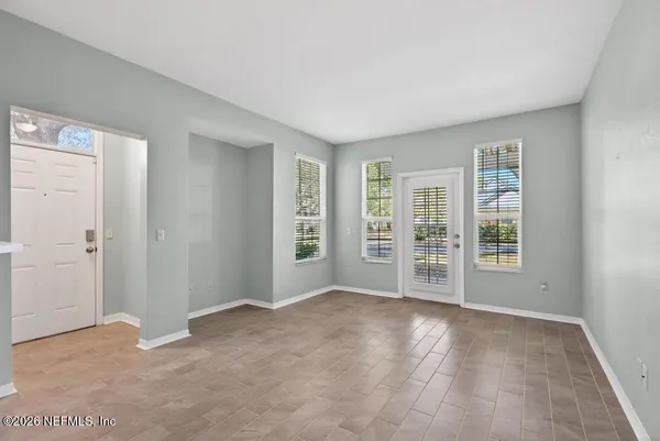 a garden view with a bench in the garden