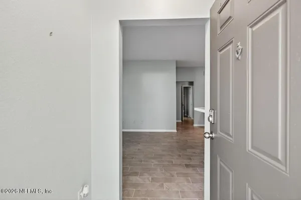 a view of a chair and tables back yard of the house