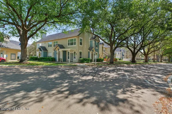 a view of a car park in front of house
