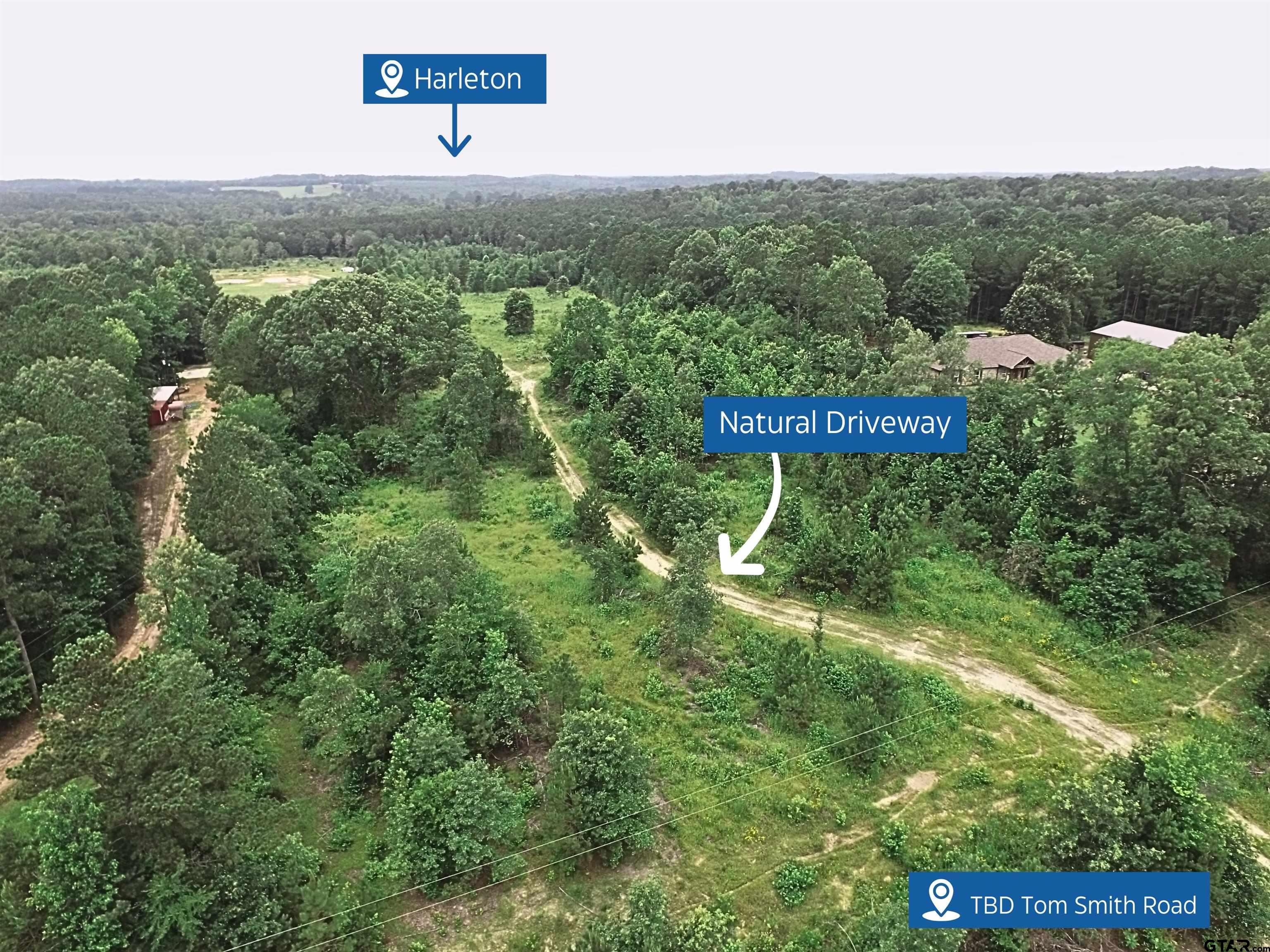 Tbd Tom Smith Road Harleton, TX 75651 - Photo 10 of 13 a view of a sign in a field