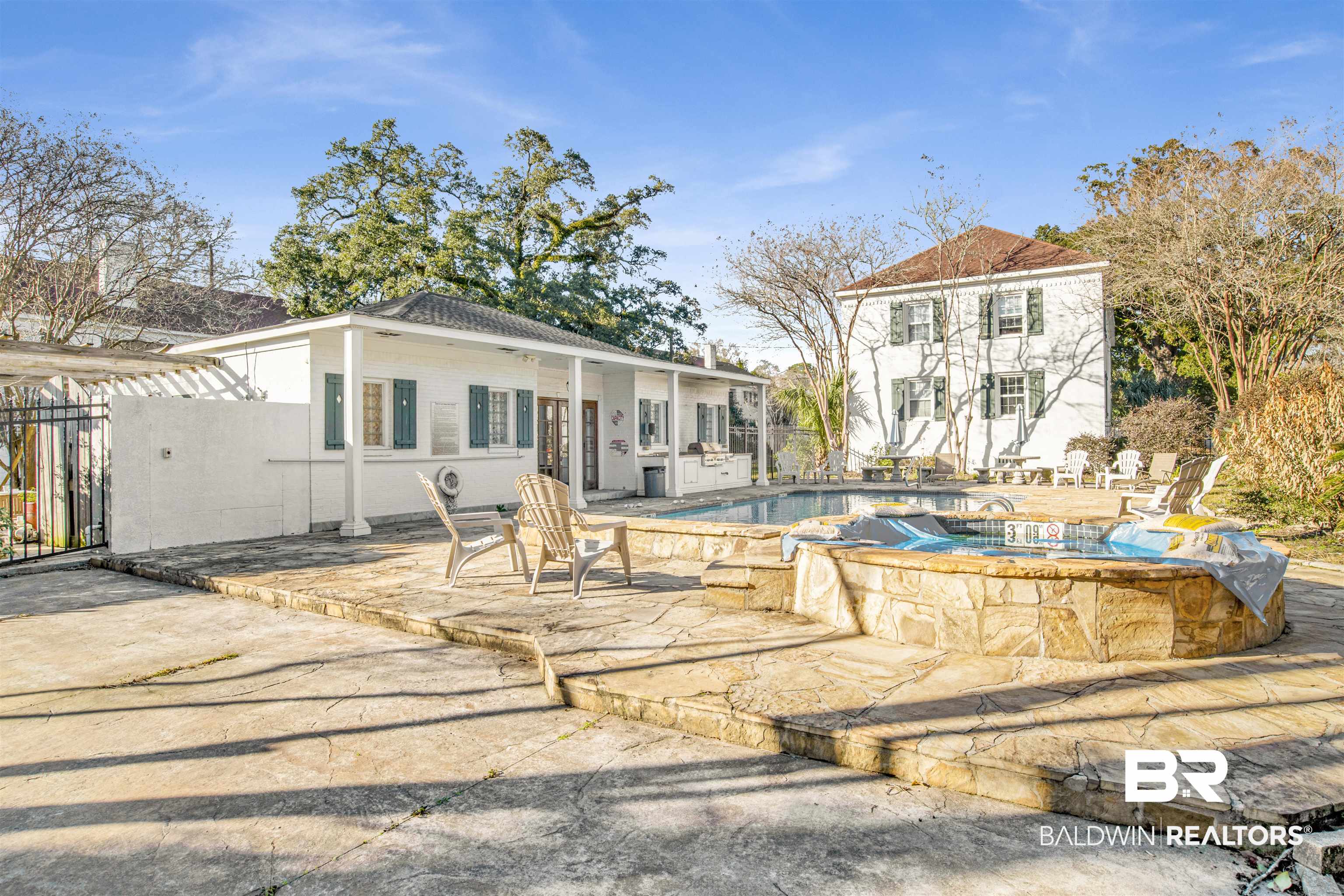 214 Upham Street, Unit 7A Mobile, AL 36607 - Photo 33 of 35 Back of property featuring a patio and a hot tub