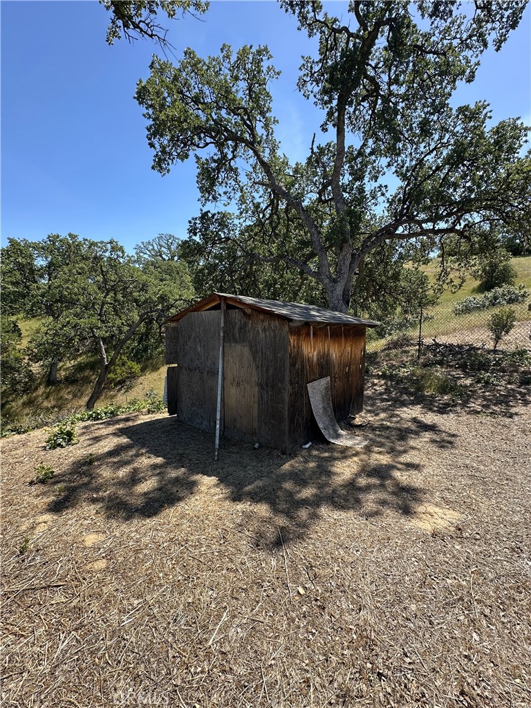 6920 Remunda Road Corning, CA 96021 - Photo 5 of 7 a view of a barn in the middle of a yard