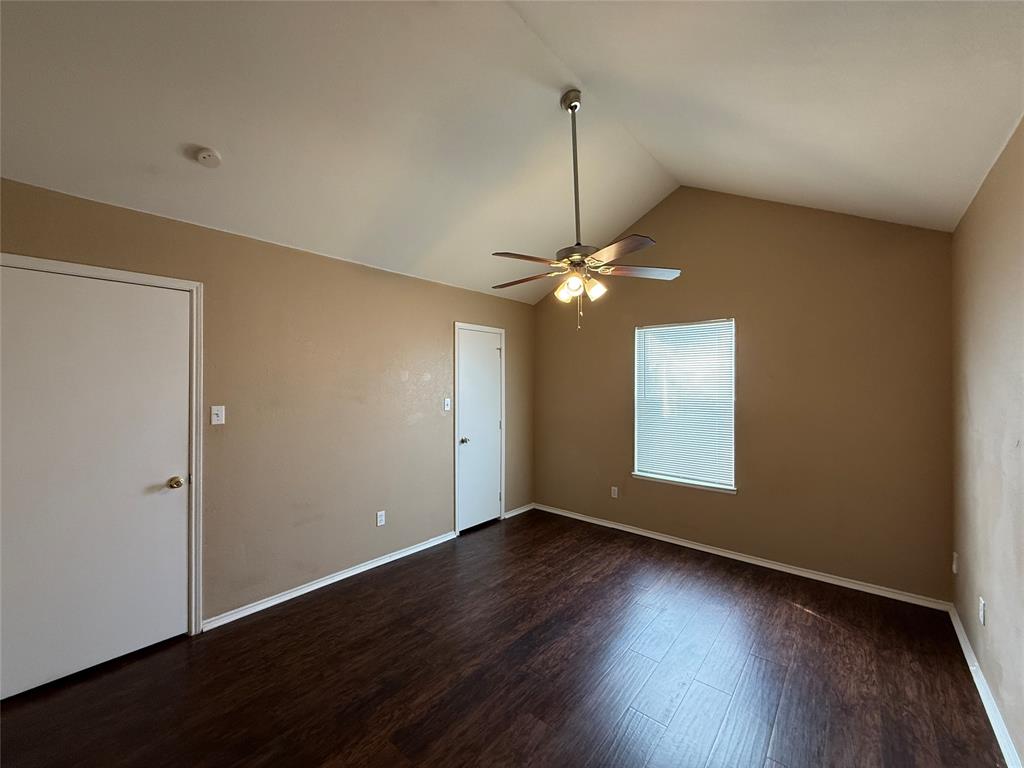 487 Pleasant Meadows Lane Dallas, TX 75217 - Photo 14 of 18 a view of empty room with wooden floor fan and window