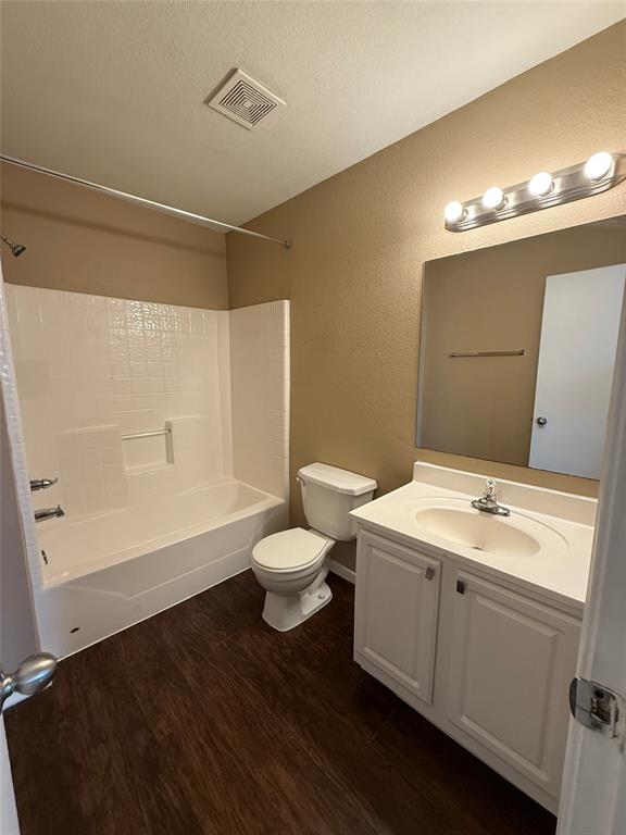 487 Pleasant Meadows Lane Dallas, TX 75217 - Photo 16 of 18 a bathroom with a sink toilet and shower