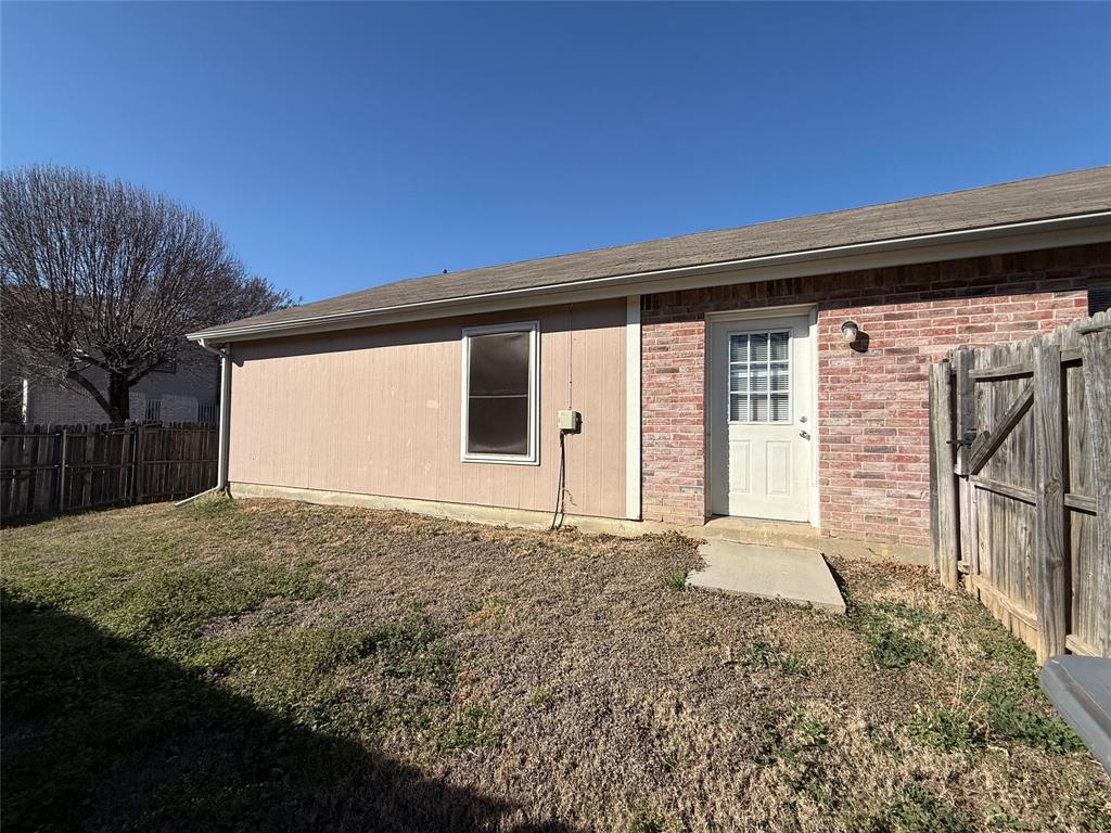 487 Pleasant Meadows Lane Dallas, TX 75217 - Photo 18 of 18 a front view of a house with garden
