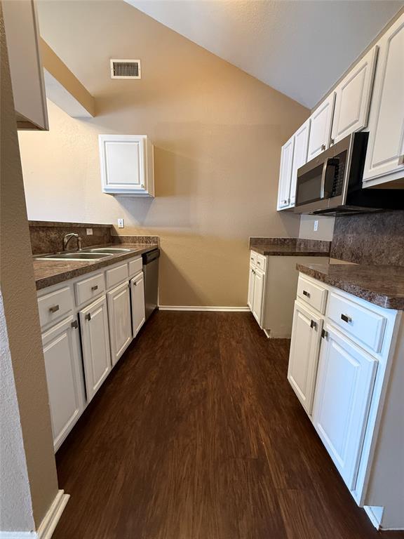 487 Pleasant Meadows Lane Dallas, TX 75217 - Photo 8 of 18 a kitchen with granite countertop a sink cabinets and wooden floor