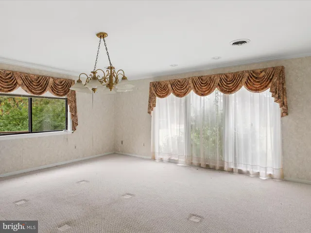a view of a room with wooden walls